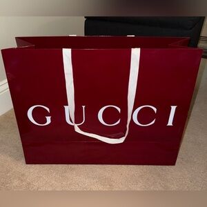 Large red Gucci shopping bag.  Perfect bag no dents.